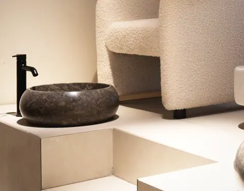 The dark stone basin in the treatment room.