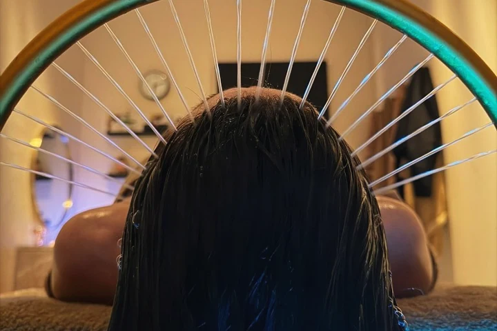 Japanese head spa at the clinic: fine streams of water falling from a brass ring onto the scalp.