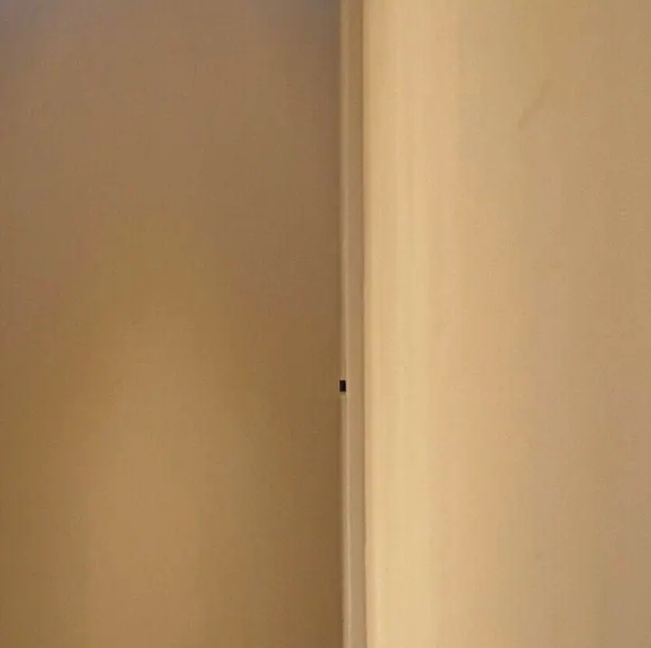 A plain stretch of warm plaster wall in the clinic.